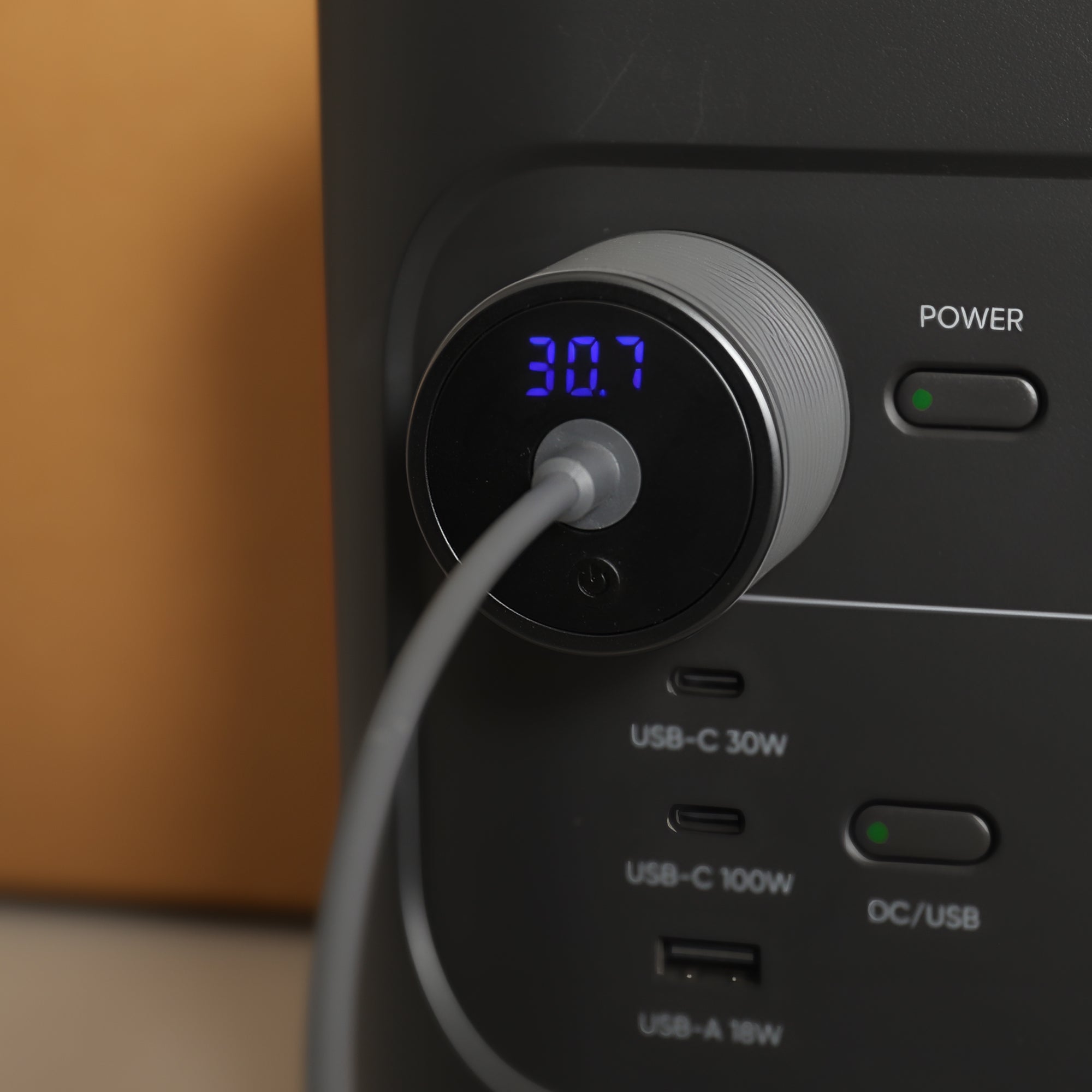 30V Step-Up Converter Firmly Seated in Vehicle Cigarette Lighter Socket, Providing Stable Power to Starlink Mini.